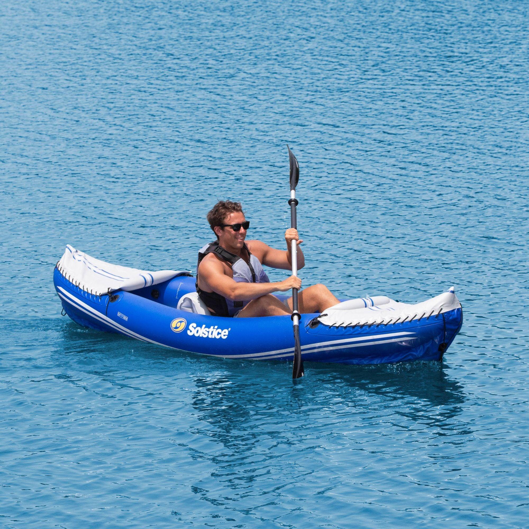 Solstice Rogue 10'6" inflatable kayak paddled by one person on calm water