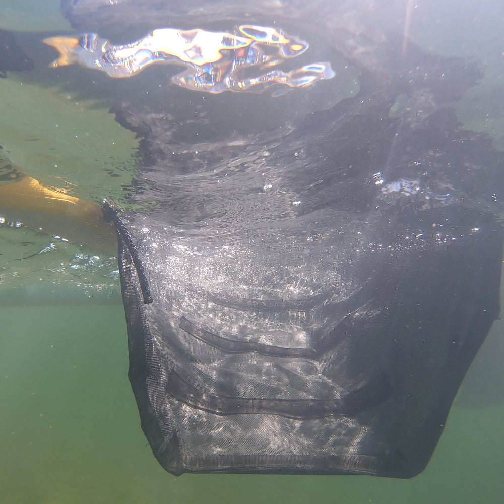 Close view of the Pup Plank weighted mesh entry dipping below the waterline